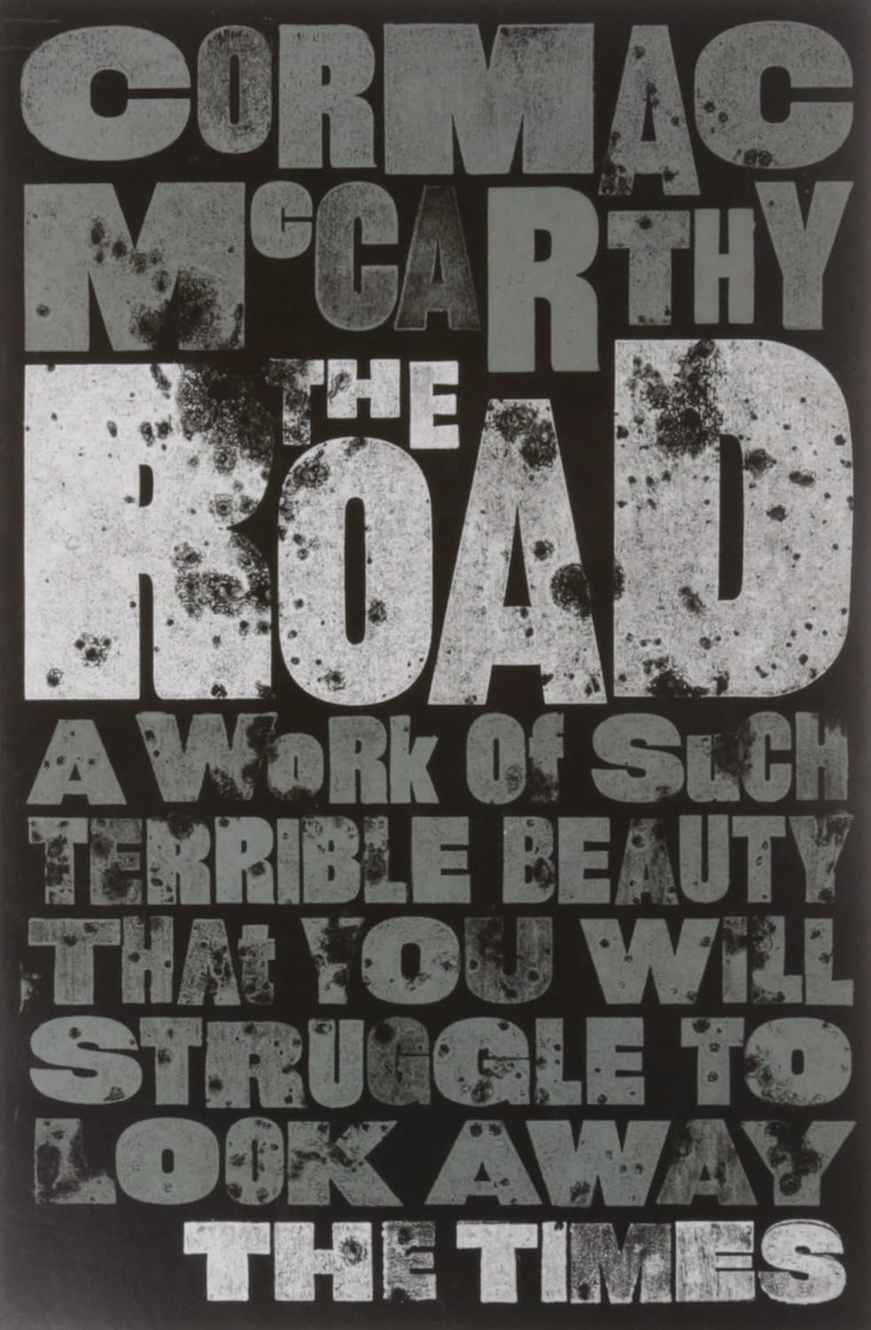 All three Cormac McCarthy paperback novels fanned out to show The Road, Blood Meridian, and No Country for Old Men covers together.