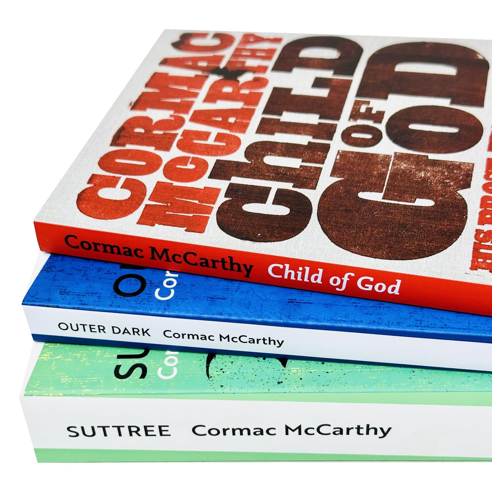 All three Cormac McCarthy paperback novels fanned out showing Suttree, Outer Dark, and Child of God covers