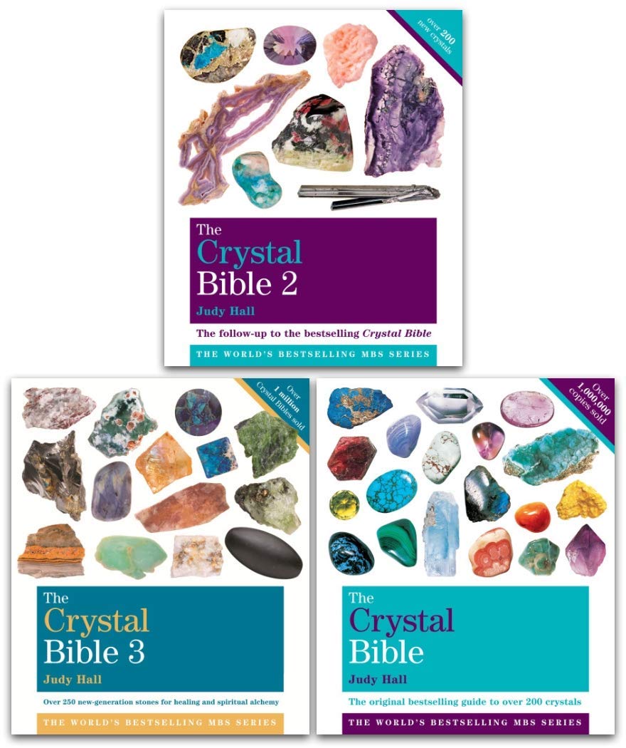 The Crystal Bible Collection by Judy Hall - 3 paperback books fanned out showing crystal photography and cover illustrations