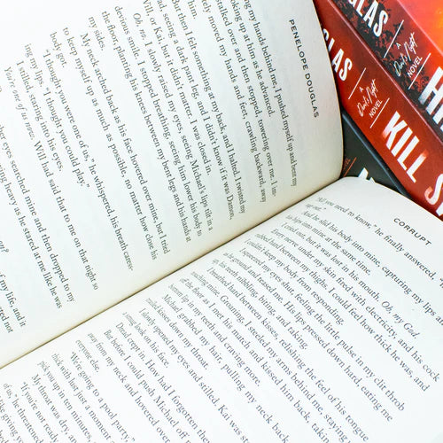 Angled view of the Devil's Night 4-book paperback collection set by Penelope Douglas on a flat surface