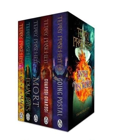 All five Discworld paperback novels by Terry Pratchett fanned out together, showing The Colour Of Magic, Equal Rites, Mort, Guards! Guards!, and Going Postal.