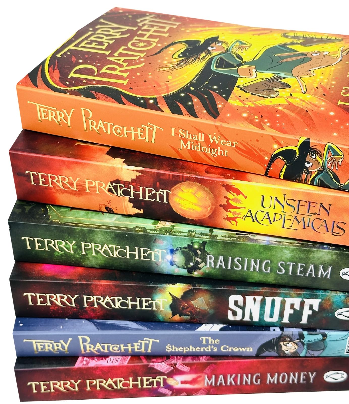 Close-up of Discworld paperback novel covers by Terry Pratchett showing fantasy artwork and titles in the set