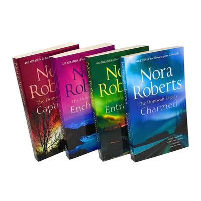 Close-up of the Donovan Legacy paperback set spines showing Captivated, Entranced, Charmed, and Enchanted by Nora Roberts.