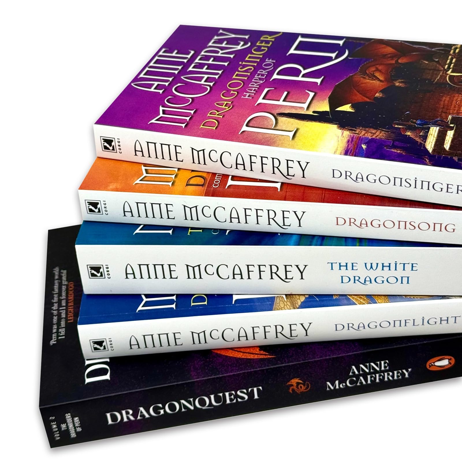 Close-up of Dragonriders of Pern paperback book covers showing Anne McCaffrey author name