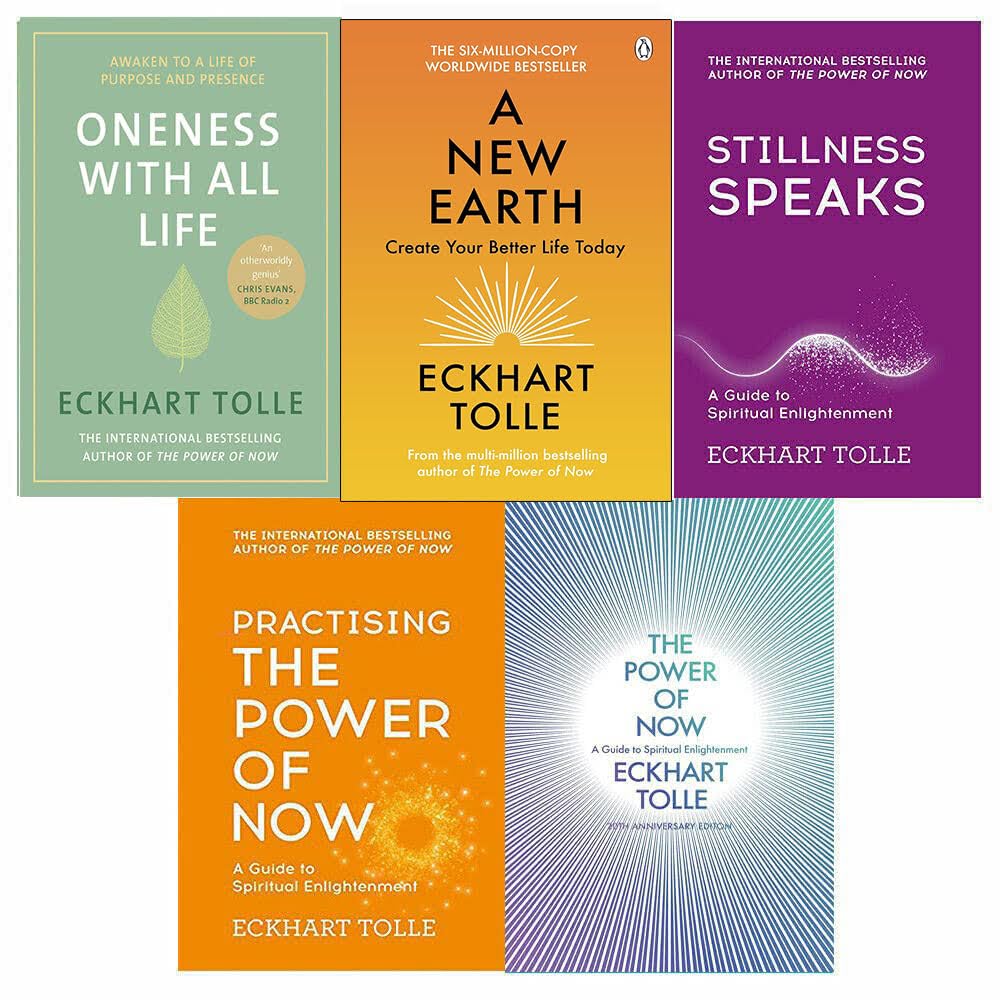Top-down view of the Eckhart Tolle paperback collection with yellow and white covers from Penguin and Hodder Mobius clearly visible.