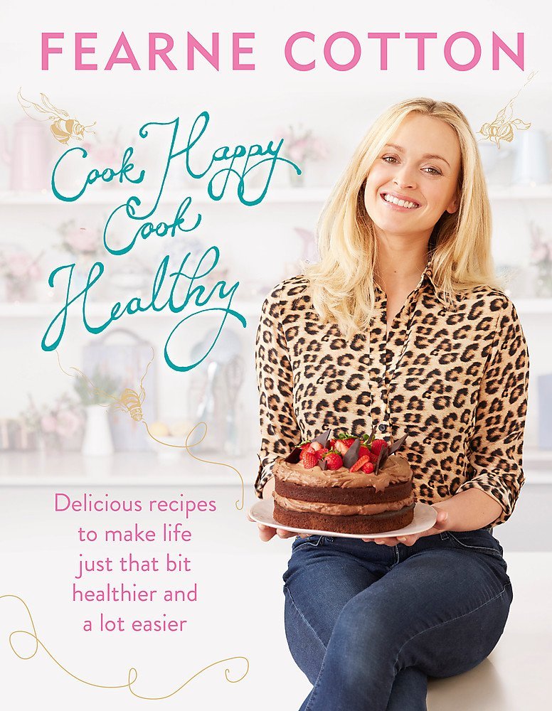 All three Fearne Cotton books fanned out together, showing Cook. Eat. Love, Cook Happy Cook Healthy, and Happy side by side