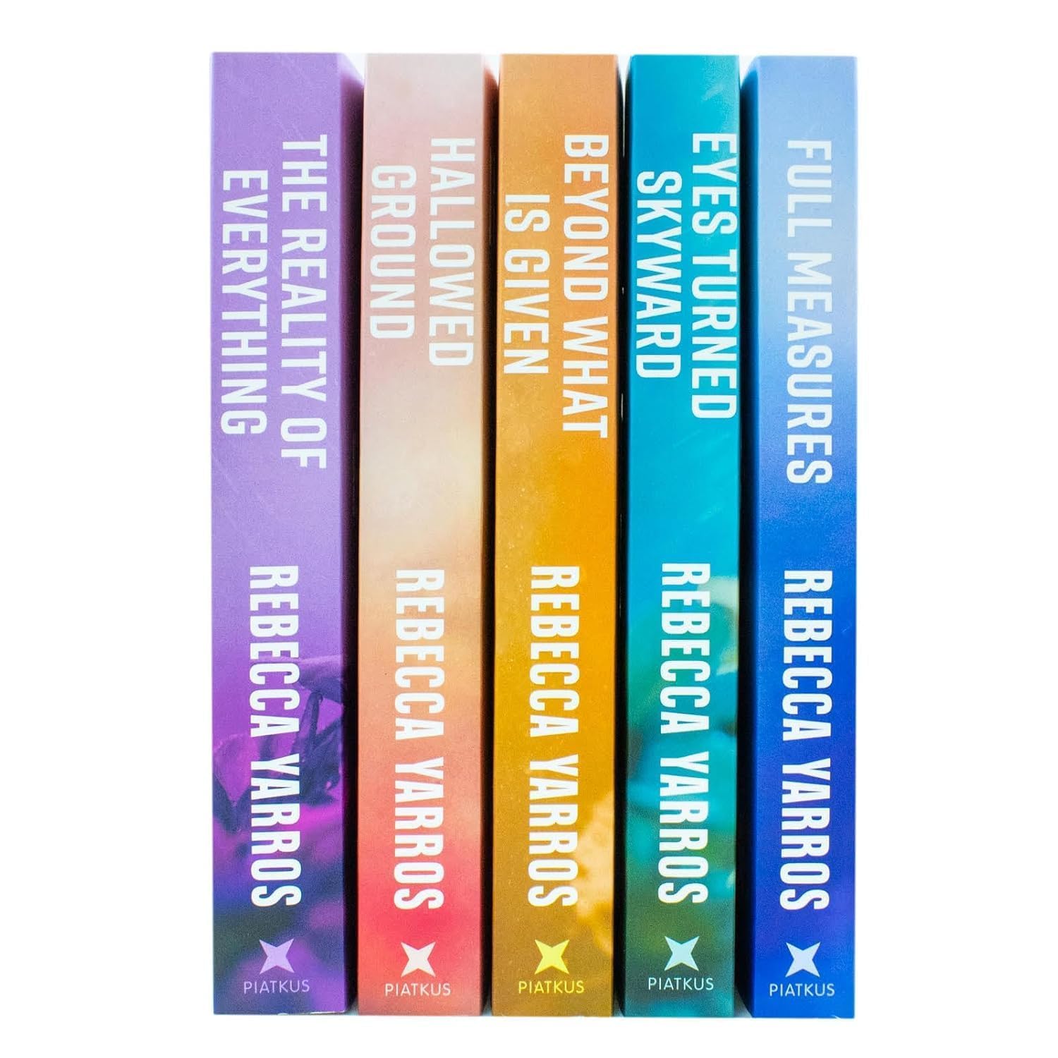 Close-up of the Flight & Glory paperback book spines by Rebecca Yarros, Piatkus edition