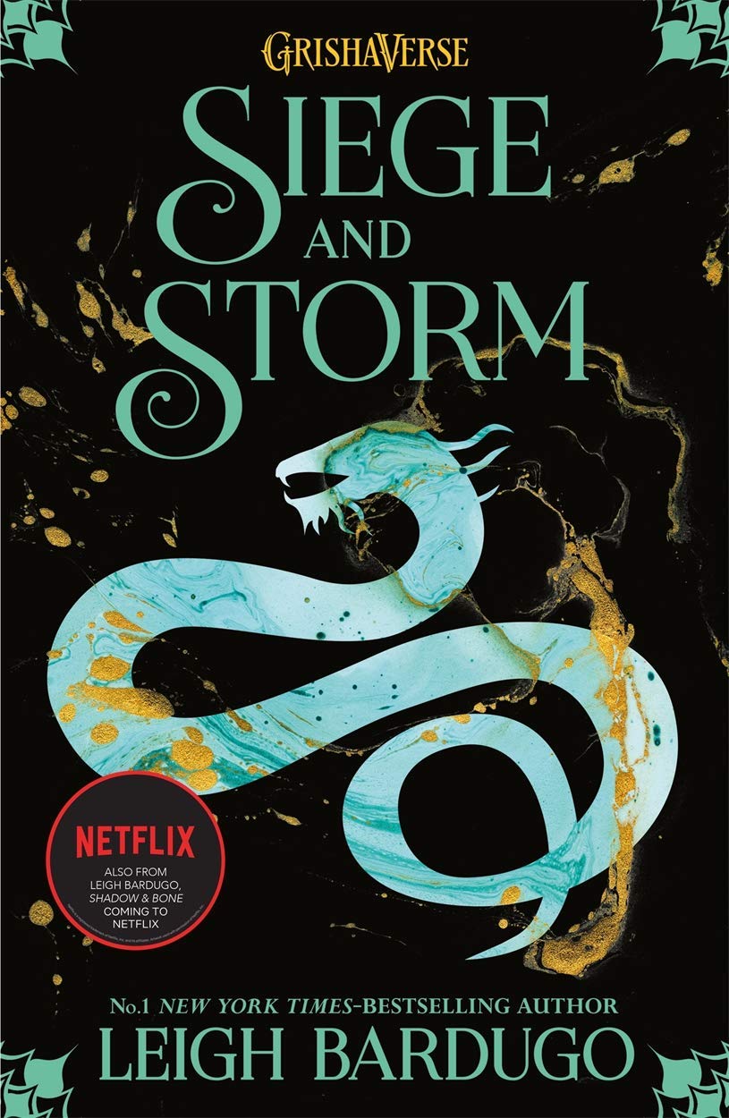 Close-up of the Ninth House and King of Scars paperback covers from the Leigh Bardugo book set