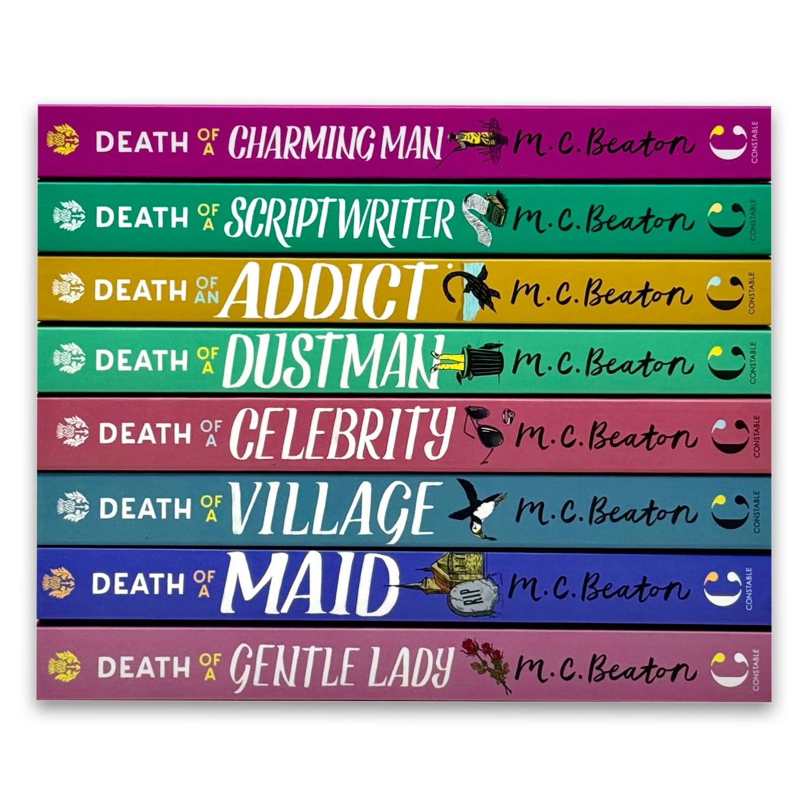 Close-up of individual paperback covers including Death of a Charming Man and Death of a Scriptwriter by M.C. Beaton