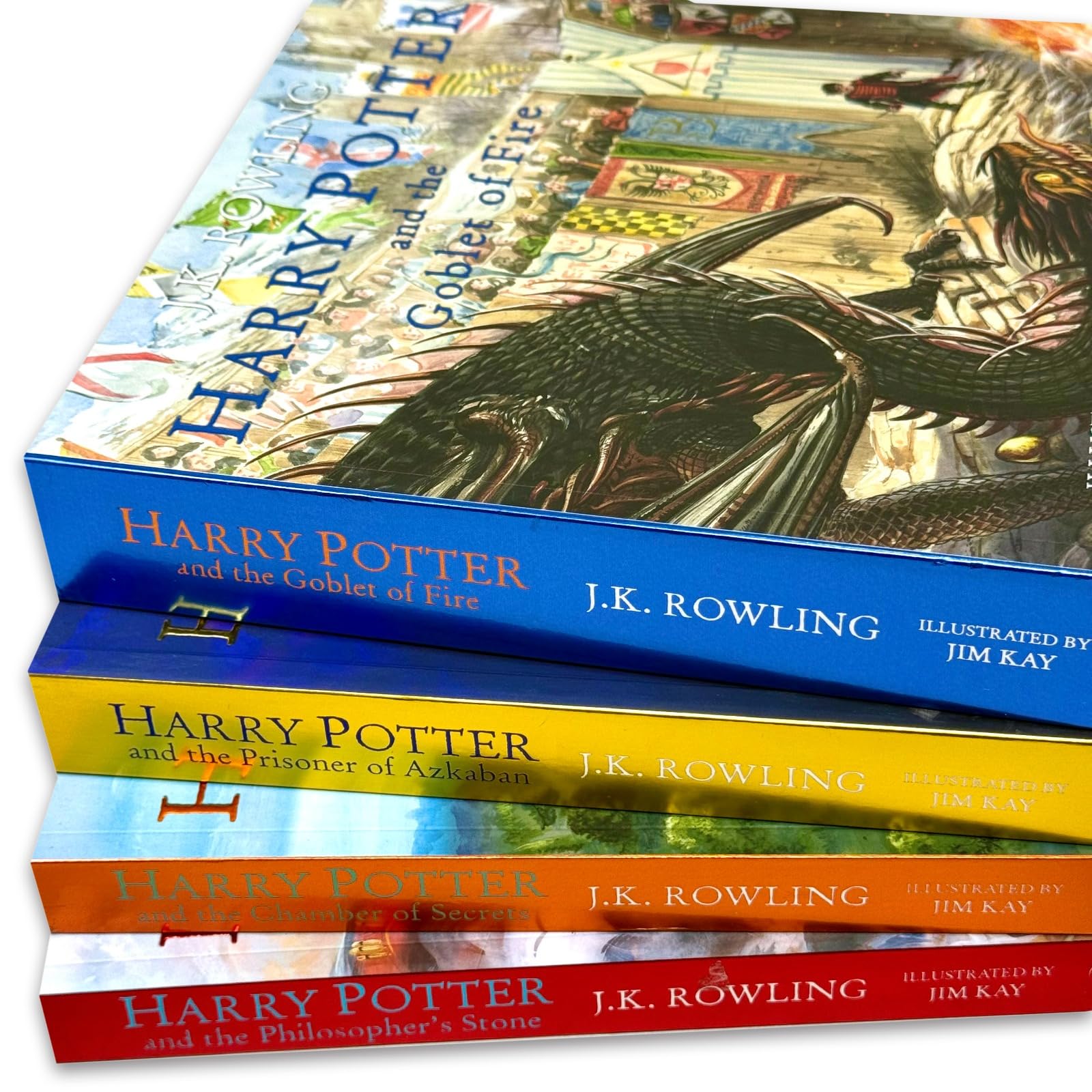 Harry Potter Illustrated Edition 4 books fanned out showing Philosopher's Stone, Chamber of Secrets, Prisoner of Azkaban, and Goblet of Fire covers