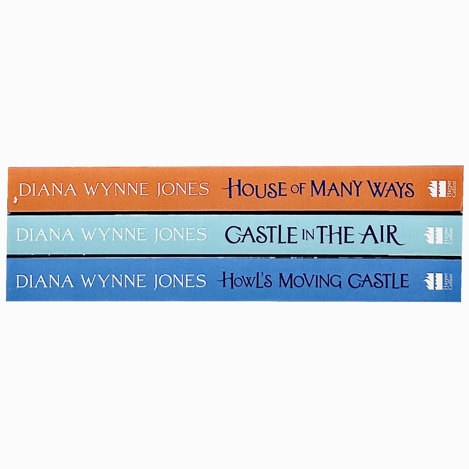The three paperback books fanned out to show the spines and cover art of the Howl's Moving Castle series by Diana Wynne Jones.