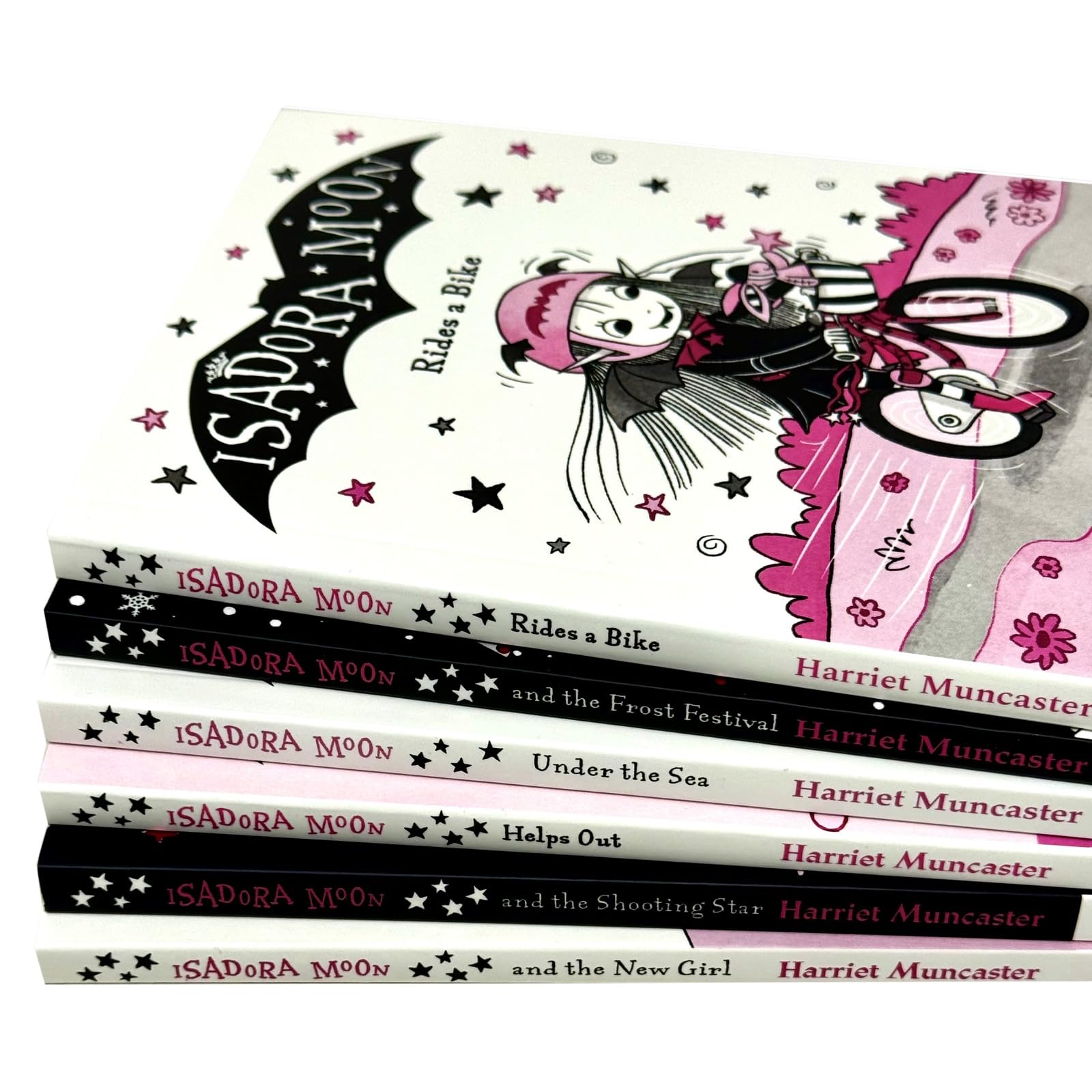Close-up of Isadora Moon Rides a Bike paperback cover illustration by Harriet Muncaster