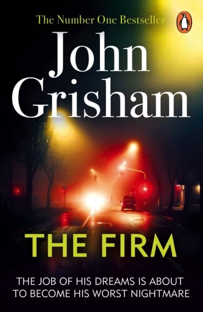 Close-up of The Firm and The Pelican Brief paperback covers by John Grisham from the Legal Classics 6 books set