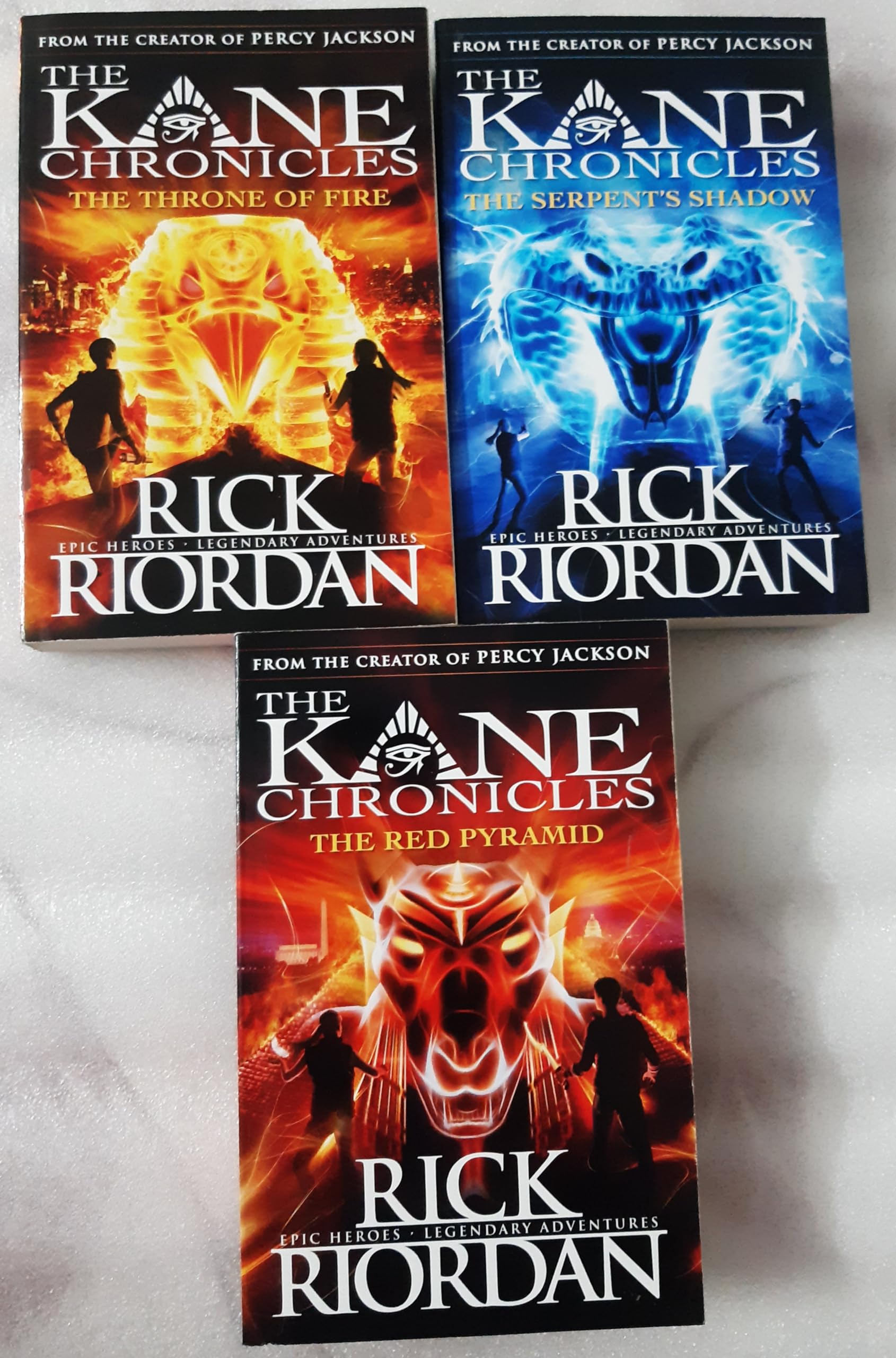 The Kane Chronicles 3-book paperback collection set by Rick Riordan showing all three covers fanned out: The Red Pyramid, The Throne of Fire, and The Serpent's Shadow