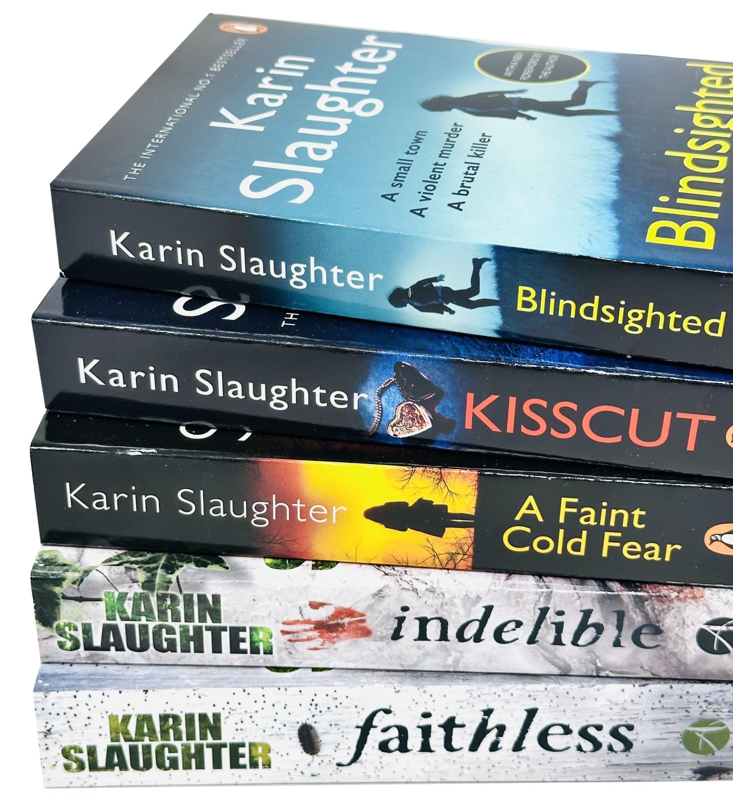 Karin Slaughter Will Trent and Grant County 9 Books Collection Set, paperback — close-up of A Faint Cold Fear and Indelible paperback covers