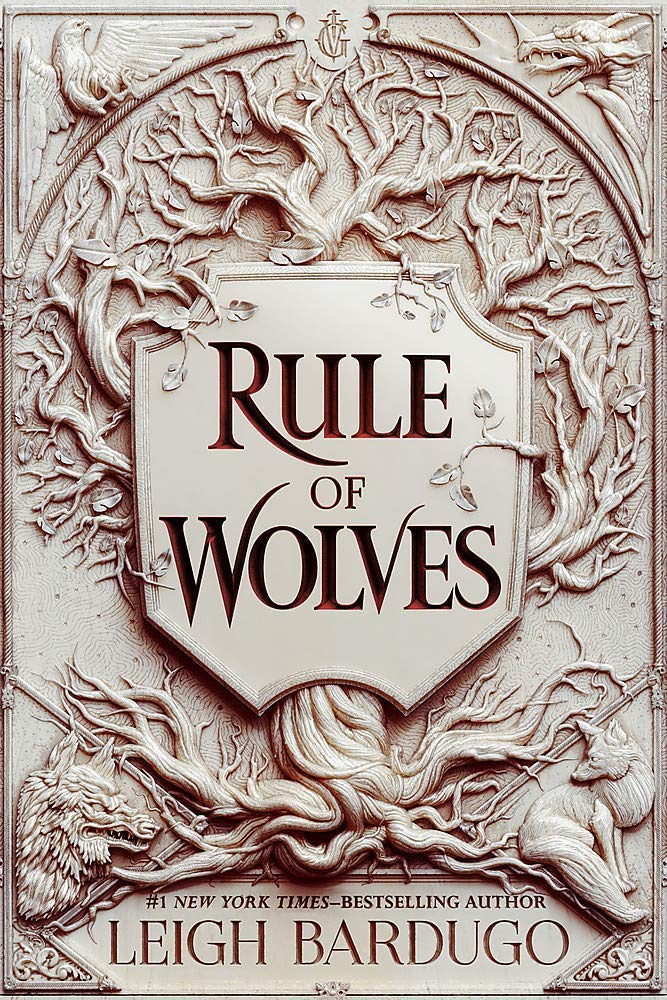 King of Scars and Rule of Wolves paperbacks stacked together showing spines and Grishaverse artwork