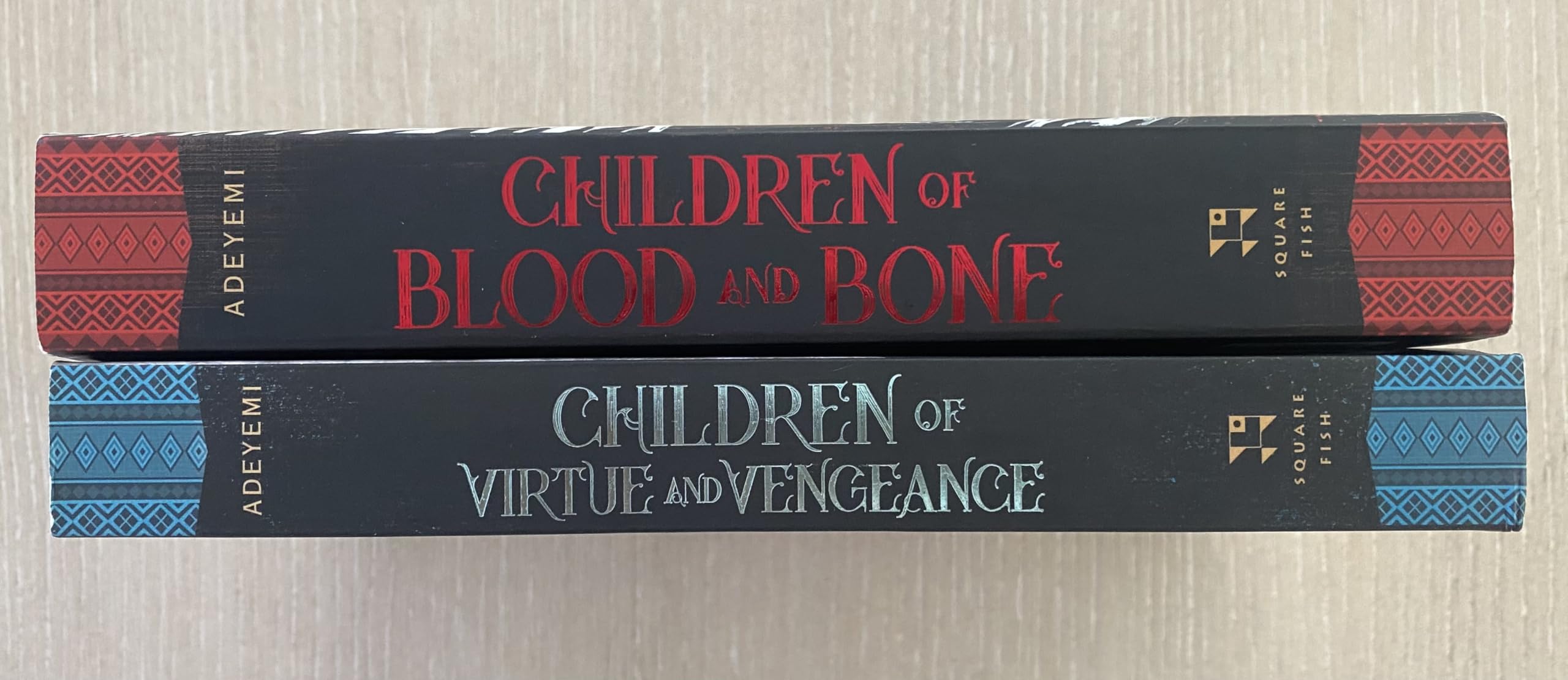 Both Legacy of Orisha paperbacks by Tomi Adeyemi fanned out together as a 2-book collection set
