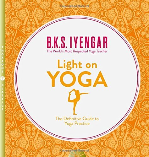 Close-up of Light on Yoga paperback cover by B.K.S. Iyengar showing yoga pose photography