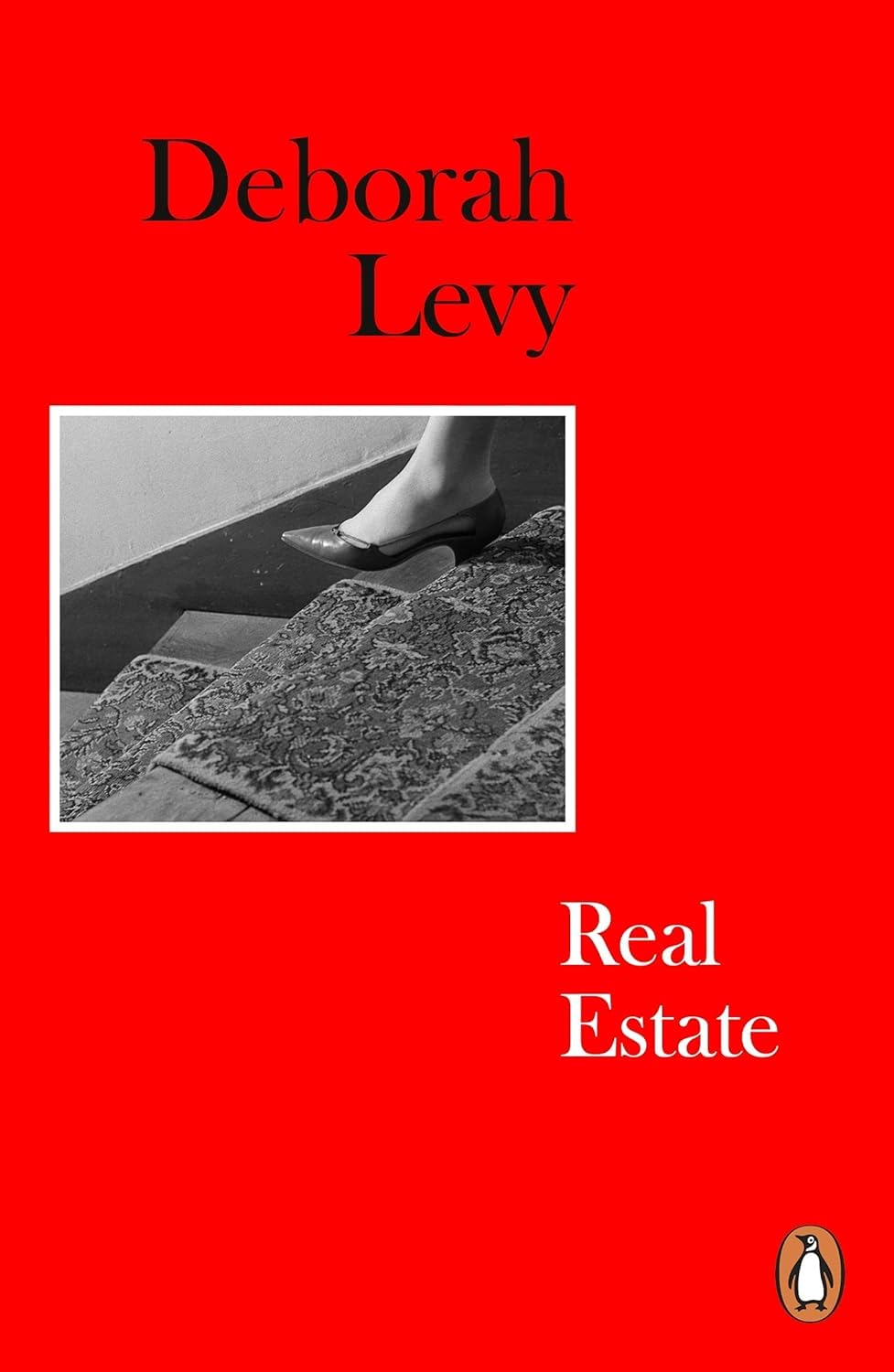 Close-up of the Deborah Levy Living Autobiography paperback set showing Things I Don't Want to Know, The Cost of Living, and Real Estate