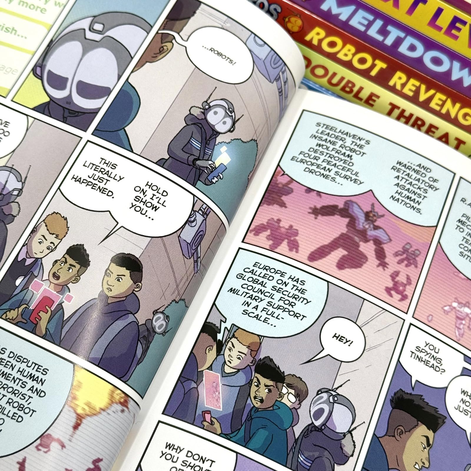 Stacked set of eight Mega Robo Bros paperback graphic novels by Neill Cameron for ages 8-12