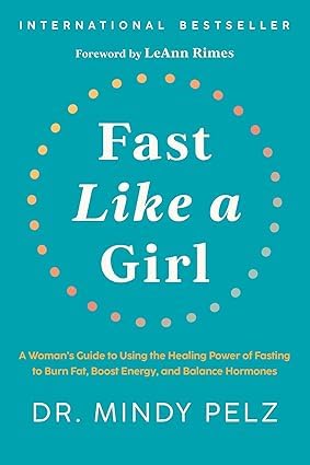 Close-up of the Fast Like a Girl and The Menopause Reset book covers from the Mindy Pelz women's health collection.