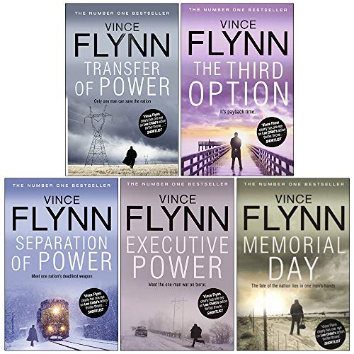 Close-up of Mitch Rapp paperback spines showing series title and Vince Flynn author name