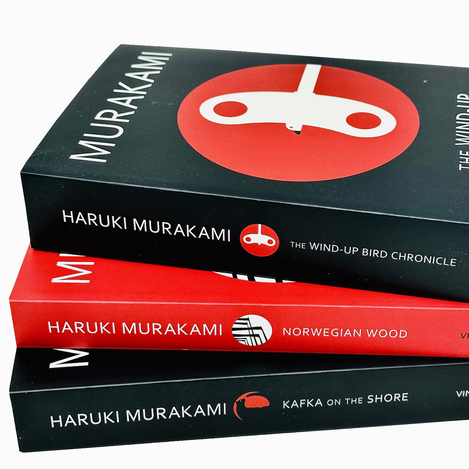 Close-up of the unique cover art and titles across the Haruki Murakami 3 Books Collection Set paperback fiction set.