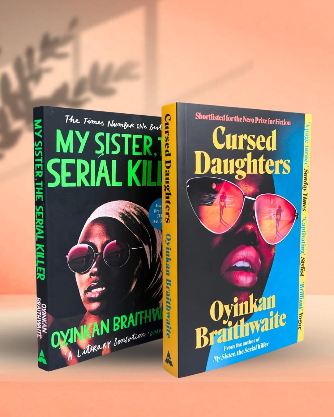 Back cover view of the Oyinkan Braithwaite paperback book set showing My Sister, the Serial Killer and Cursed Daughters