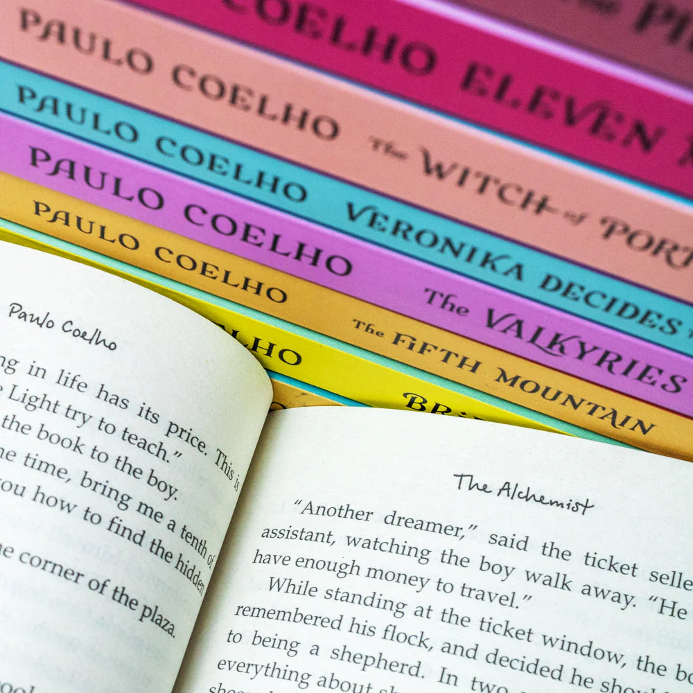 Full set of Paulo Coelho Classics Collection paperbacks arranged to show back cover blurbs and titles