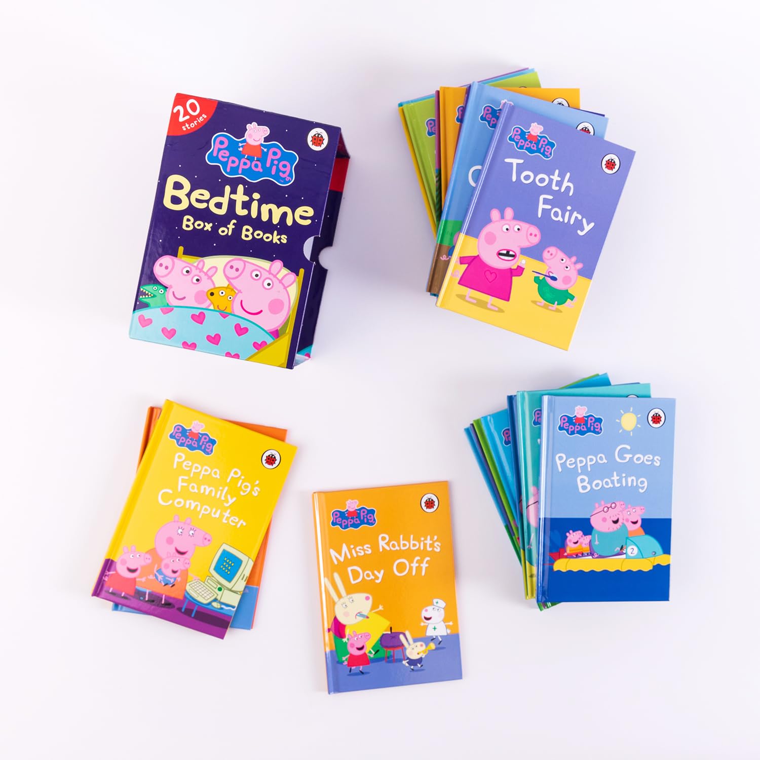 Close-up of Peppa Pig hardback mini storybooks stacked showing spines and titles