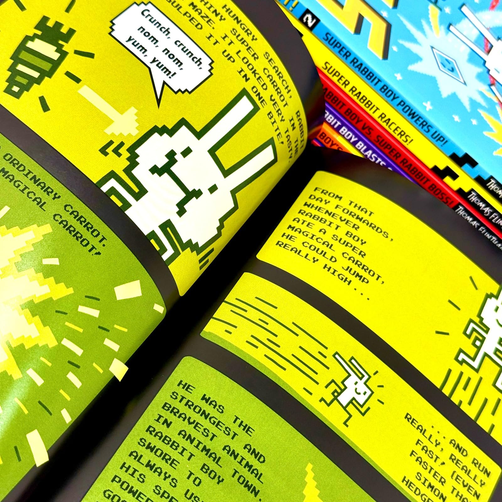 Inside page spread of a Press Start! book showing bold, blocky, video-game-inspired illustrations by Thomas Flintham