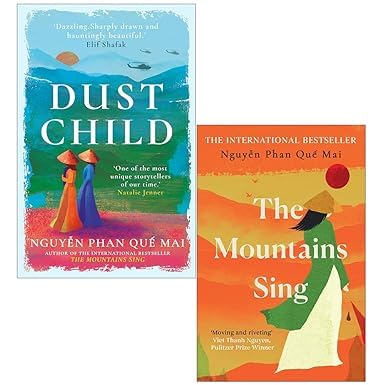 Que Mai Collection by Nguyen Phan Que Mai, Dust Child hardcover and The Mountains Sing paperback stacked on a wooden surface.