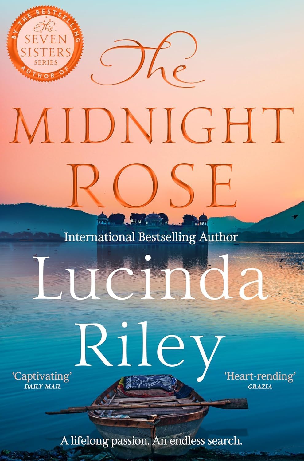 Close-up front cover of The Midnight Rose by Lucinda Riley paperback historical fiction novel