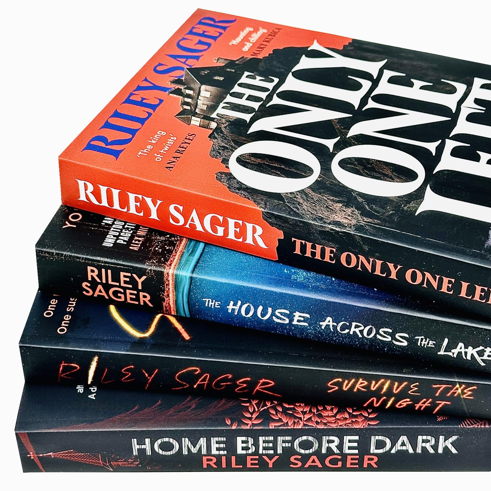 Close-up of the four Riley Sager paperback book covers fanned out, highlighting the artwork for each individual title.