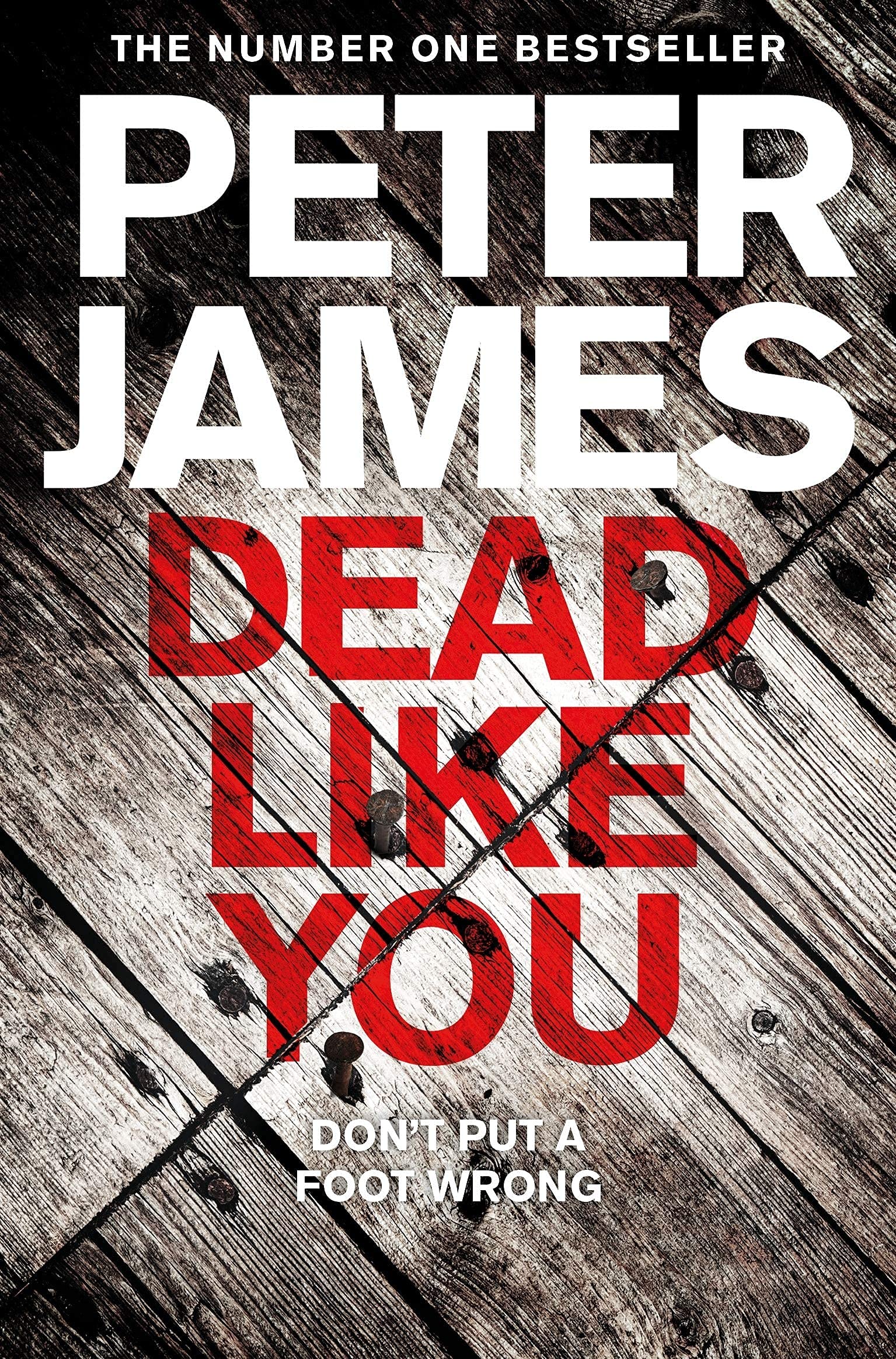 All six Roy Grace paperback books by Peter James fanned out to show the complete collection