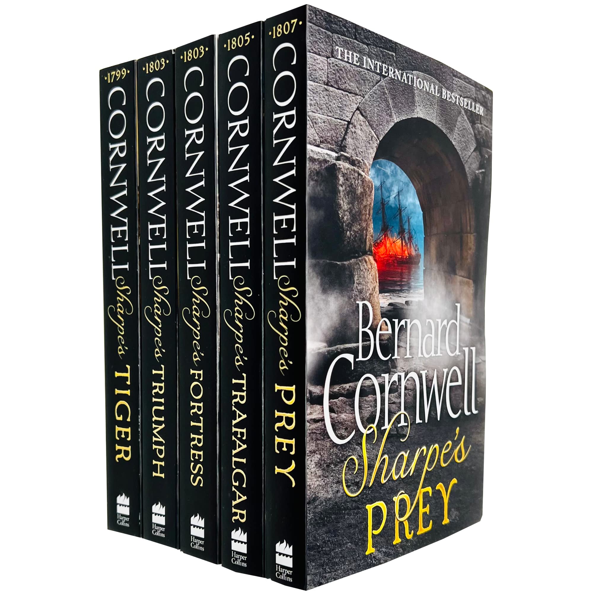 All five Sharpe paperback novels by Bernard Cornwell fanned out showing spines and titles