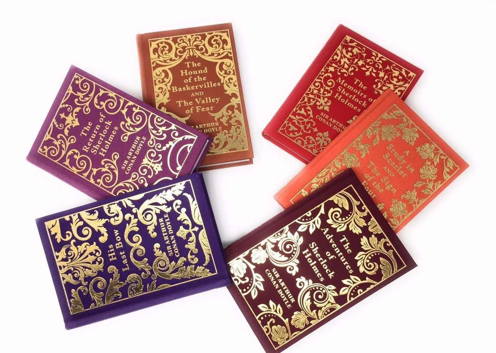 The Sherlock Holmes Collection 6 hardback volumes fanned out showing all titles including The Hound of the Baskervilles and A Study in Scarlet
