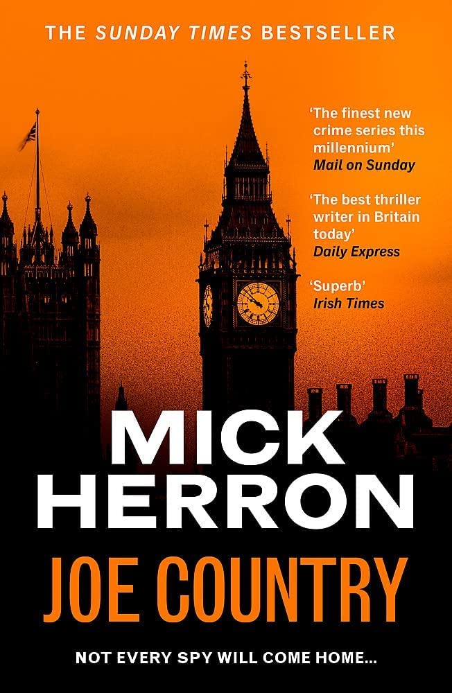 Close-up of Slough House series paperback covers by Mick Herron featuring Slow Horses and Dead Lions cover artwork.