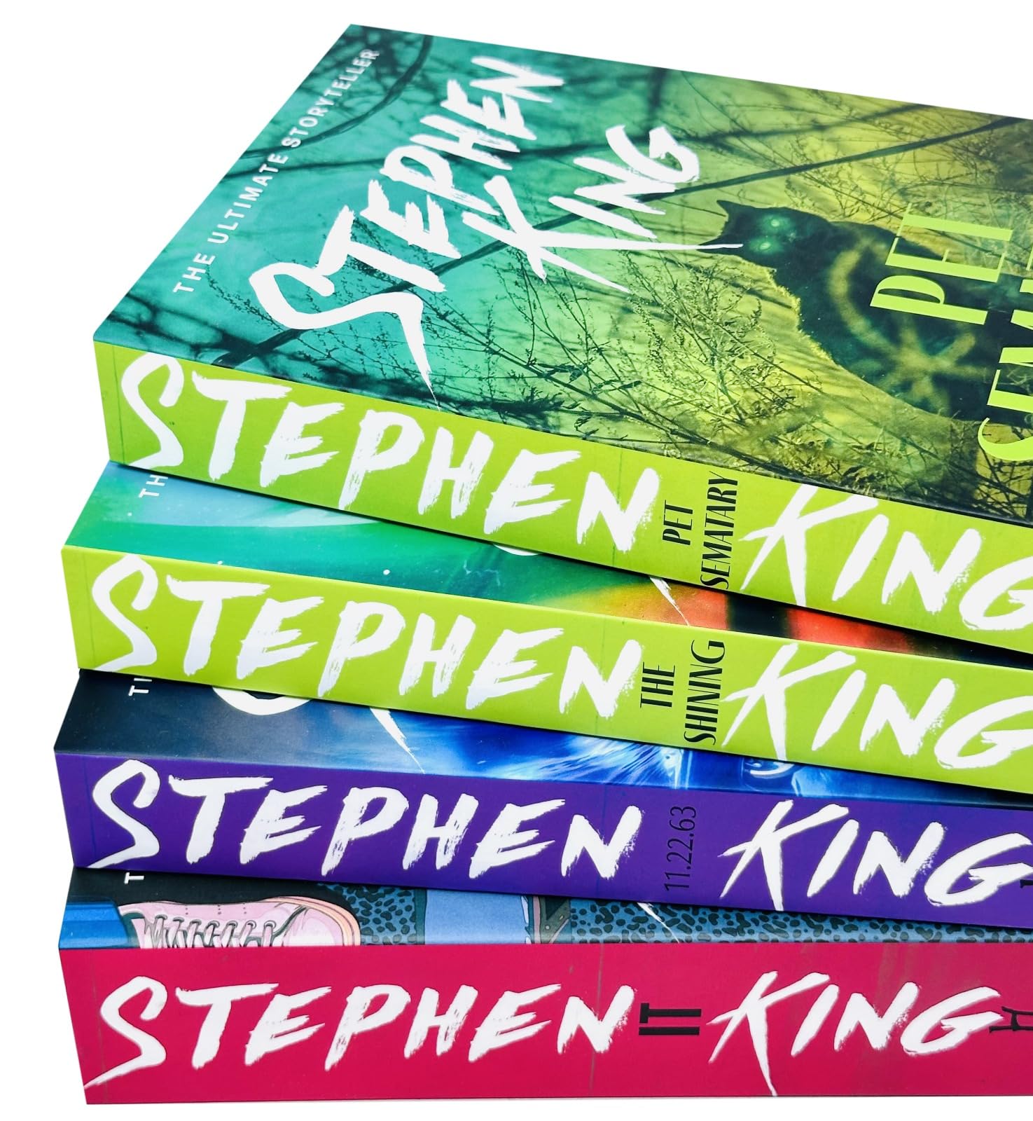 All four Stephen King paperback novels fanned out showing spines: It, 11.22.63, The Shining, Pet Sematary