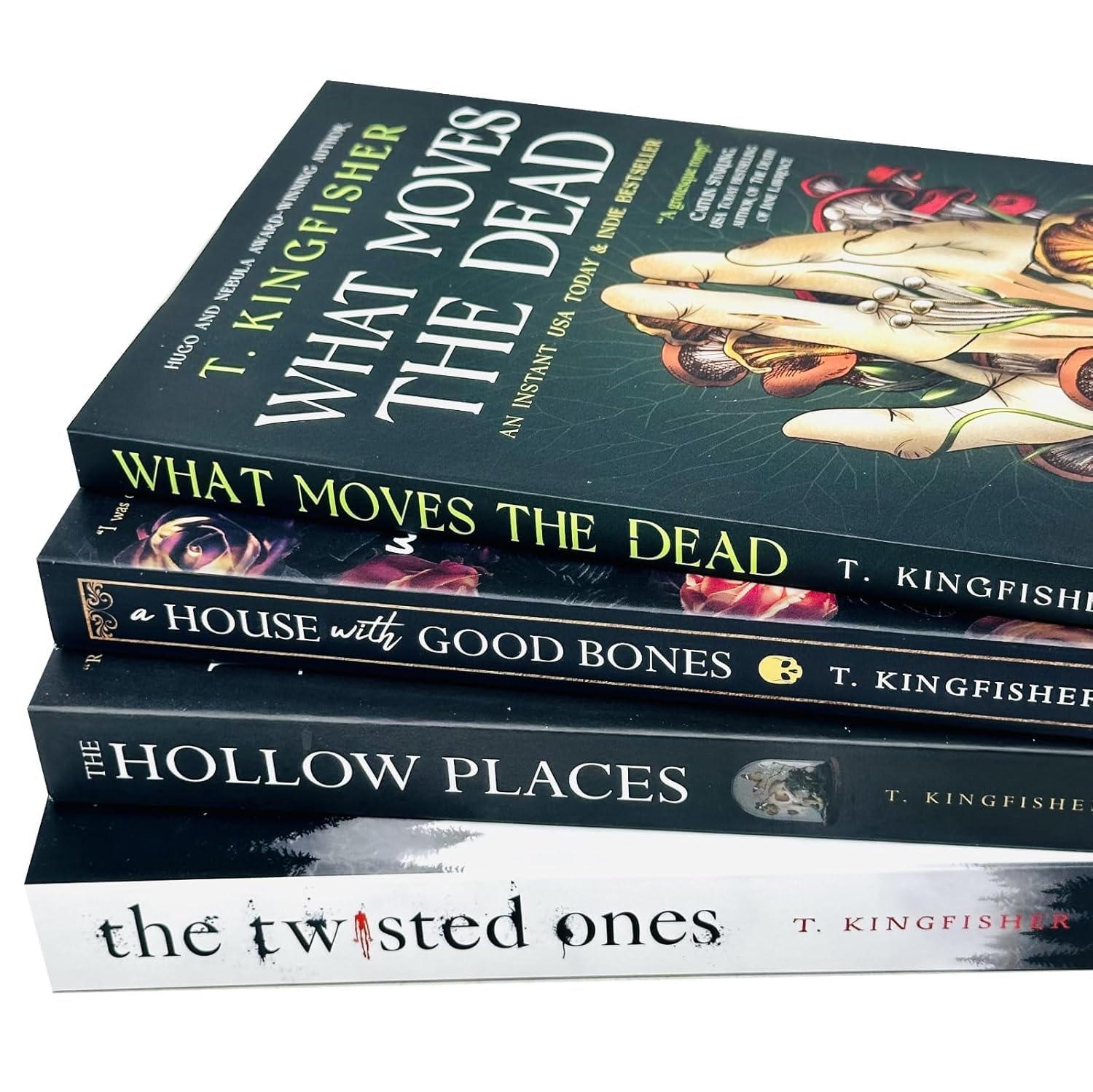 Full spread of the T. Kingfisher 4-book paperback horror collection fanned out, displaying the covers of all four included novels.