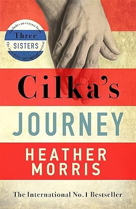 All four paperbacks in the Heather Morris collection fanned out, including Sisters Under the Rising Sun