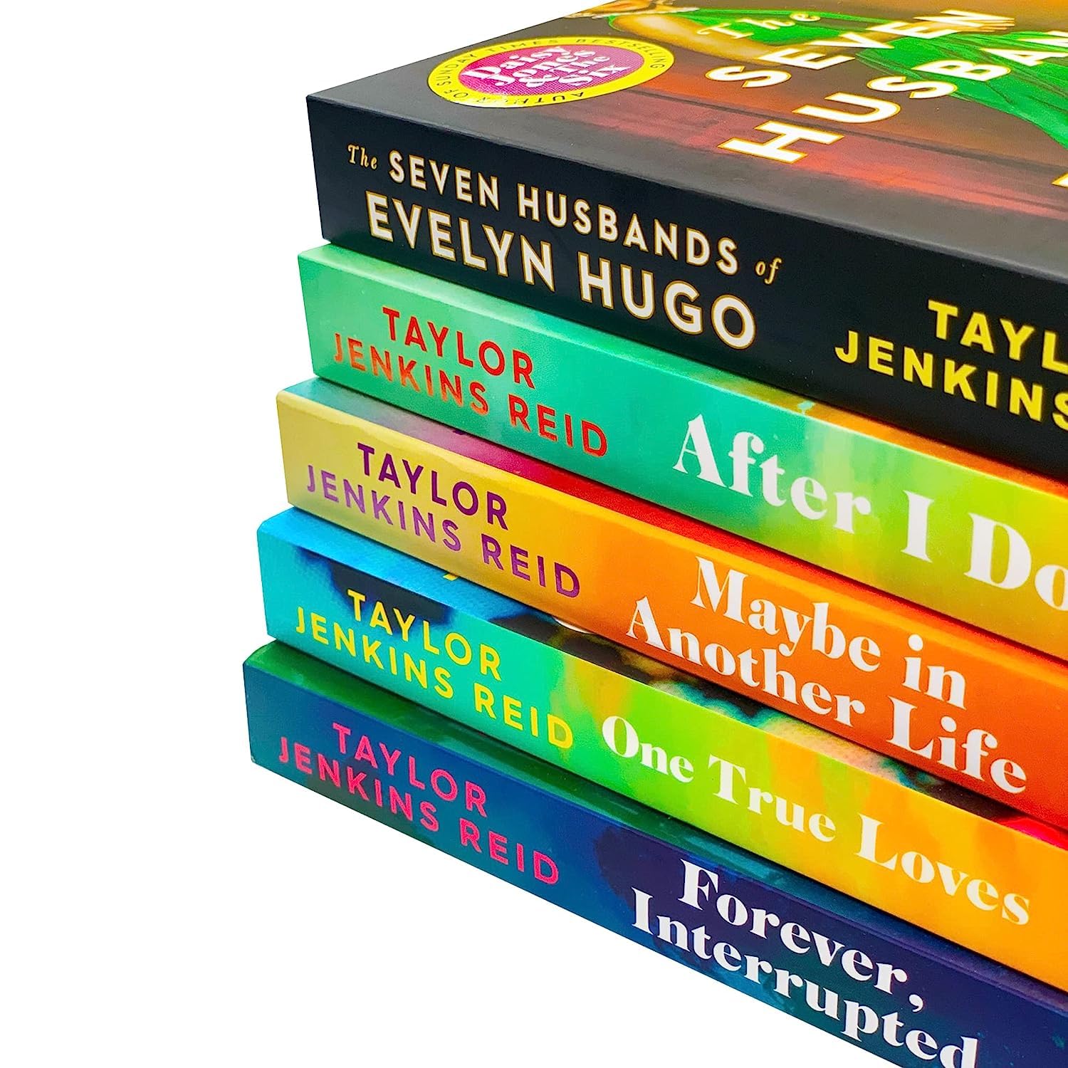 Full Taylor Jenkins Reid paperback book set fanned out showing spines and back covers of all five fiction novels in the collection