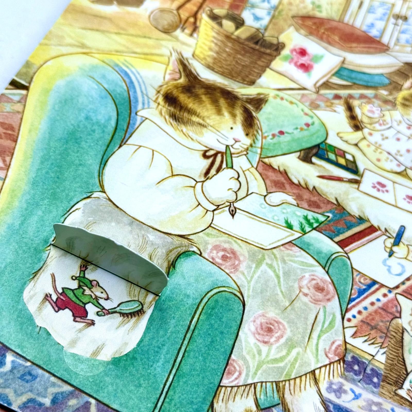 All four Cat Family hardcover books fanned out showing the full collection
