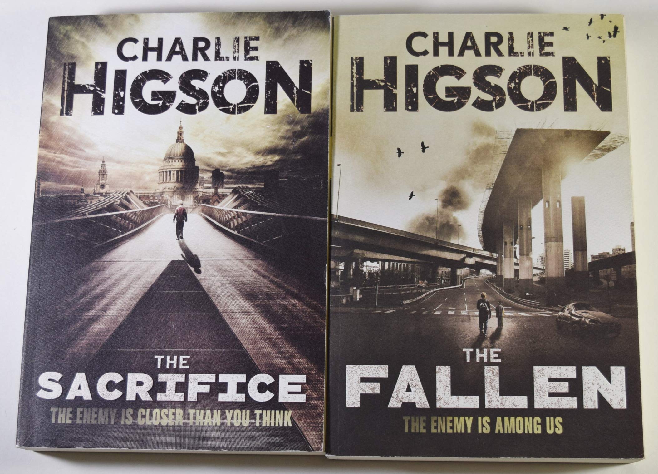 Full stack of all 7 Enemy series paperback books by Charlie Higson arranged together