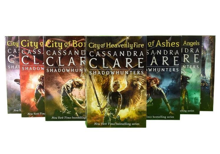 Close-up of The Mortal Instruments paperback box set by Cassandra Clare, highlighting the Shadowhunters cover artwork and book titles.