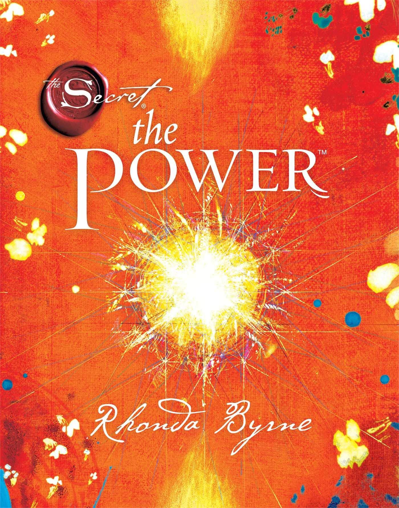 The Secret Series 4 books collection set by Rhonda Byrne fanned out on a wooden surface showing all four covers