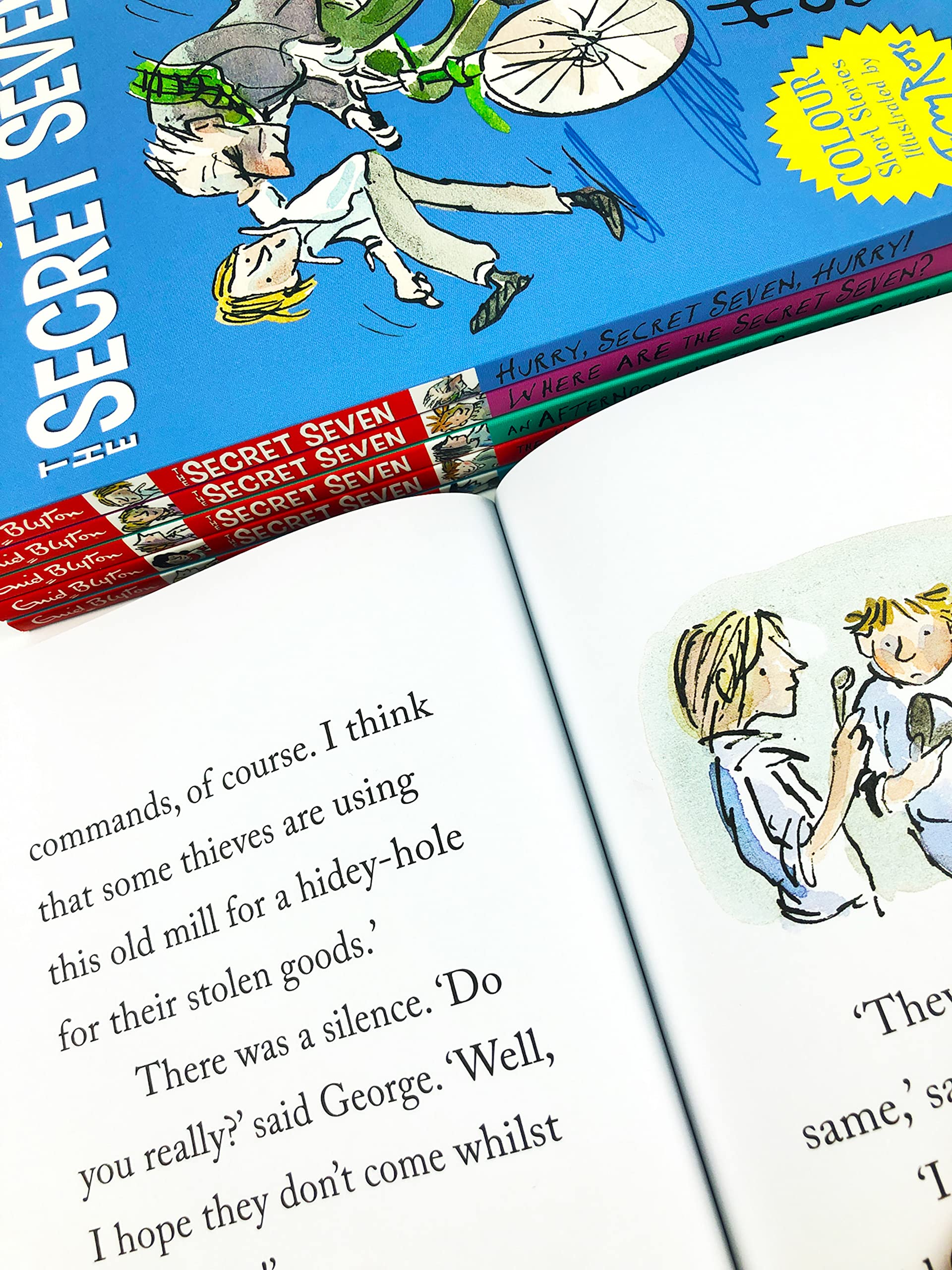 All six Secret Seven paperback books by Enid Blyton fanned out showing individual titles