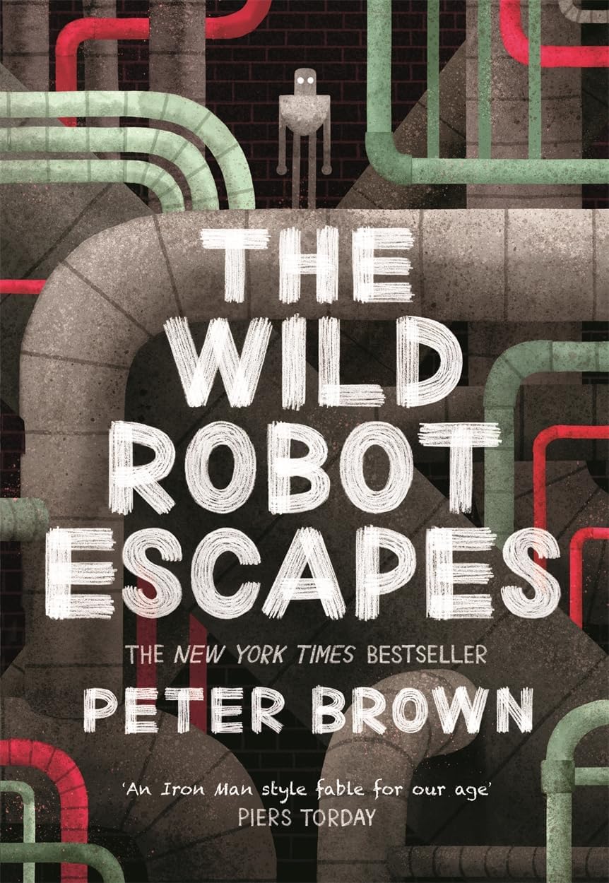 All four Wild Robot paperback books fanned out, showing The Wild Robot, Escapes, Protects, and on the Island covers