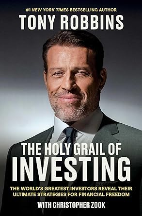 Close-up of the Unshakeable and The Holy Grail of Investing paperback covers by Tony Robbins, showing title and author details