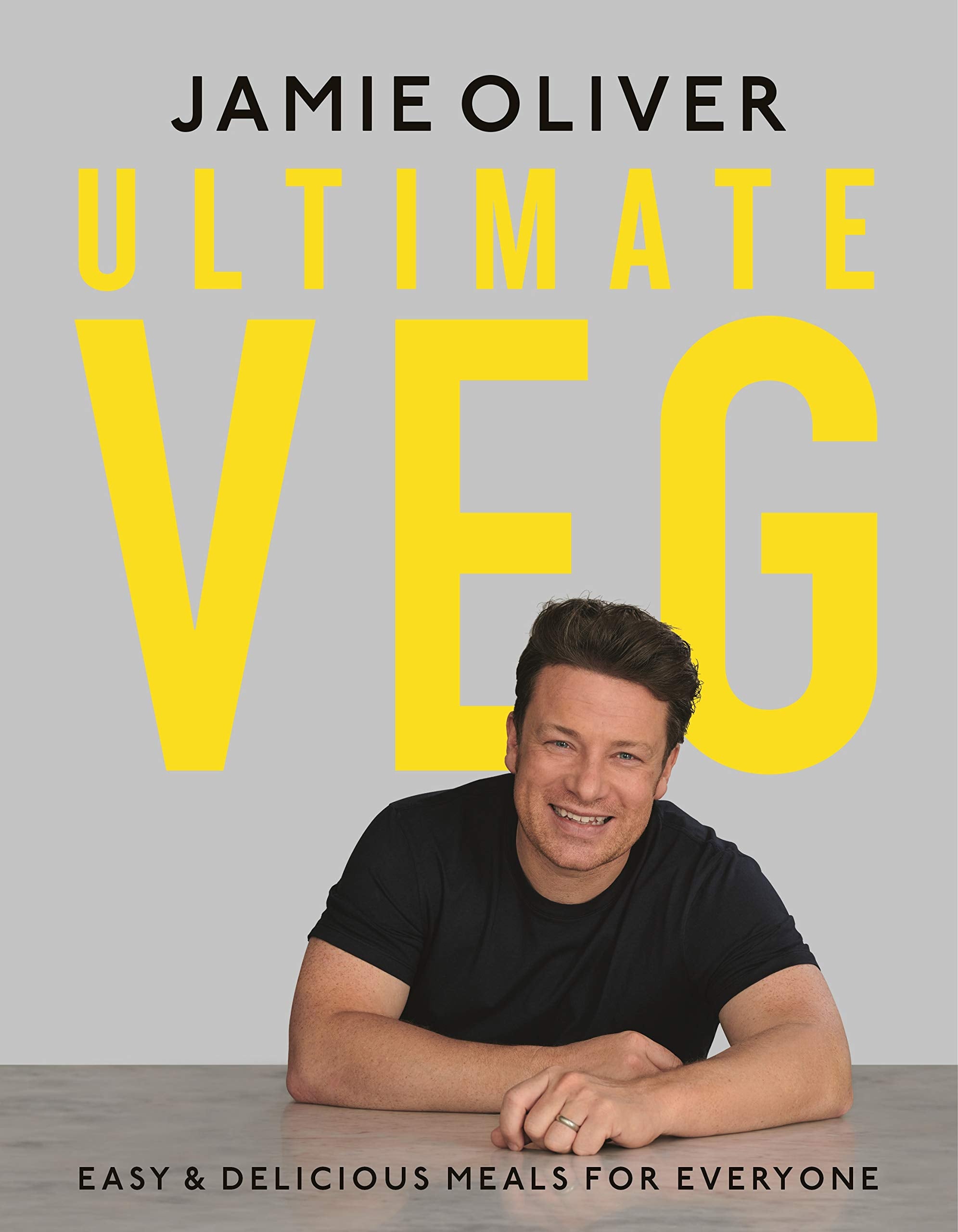 Front cover of Ultimate Veg hardcover cookbook by Jamie Oliver, featuring vibrant vegetable illustrations.